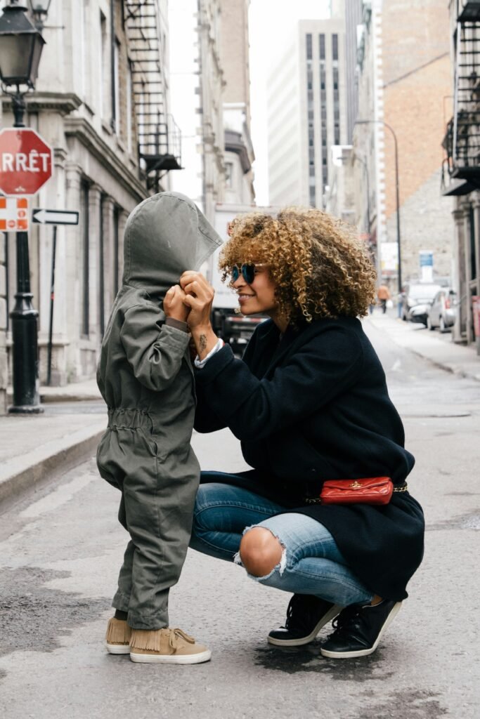 Explore the Ultimate Destination for Hawaiian Shirts Online 1 woman holding kid at the street