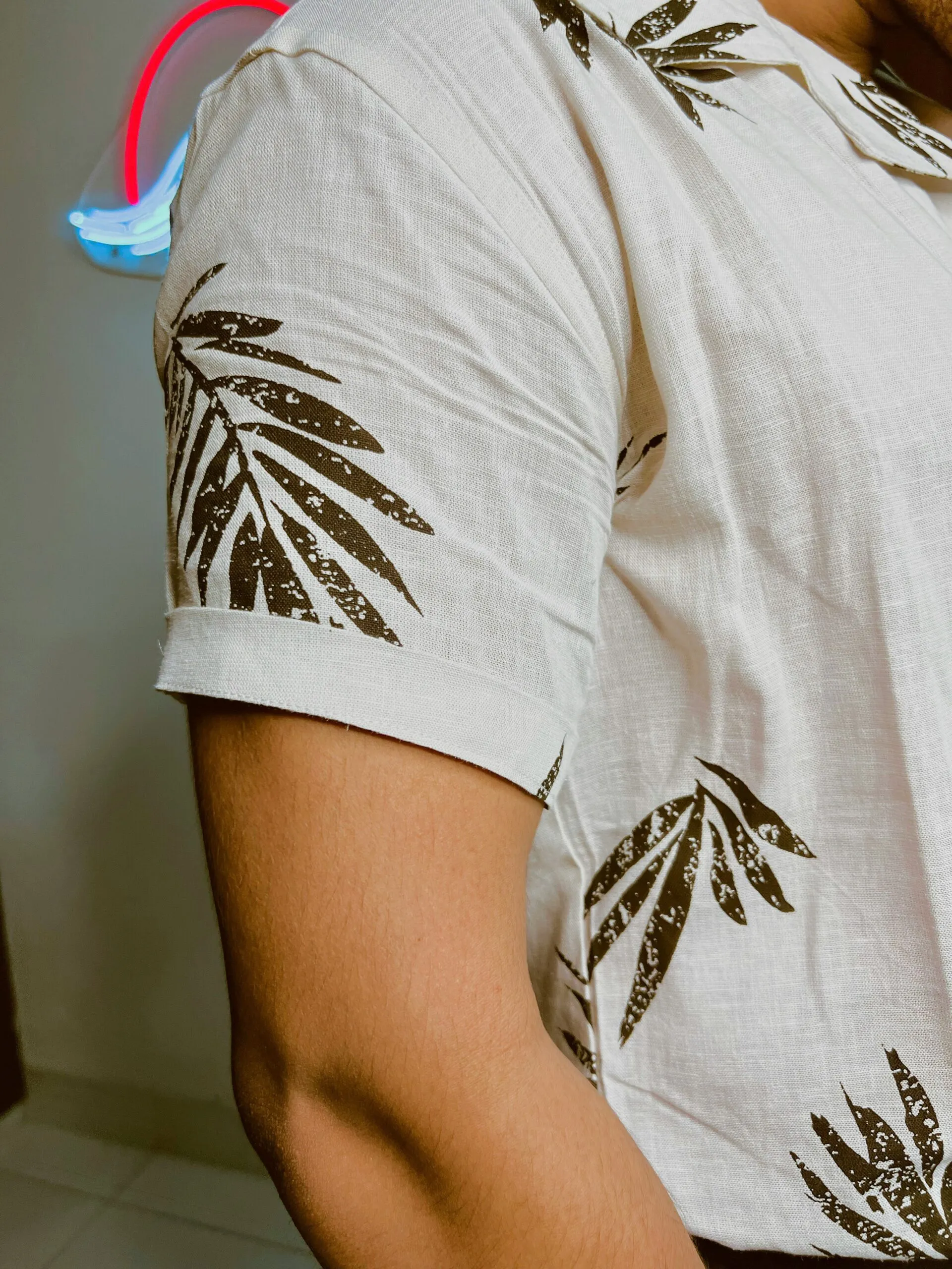 Your Ultimate Destination for Hawaiian Shirts Online 24 a person's arm with a tattoo on it